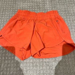 Orange Lululemon shorts